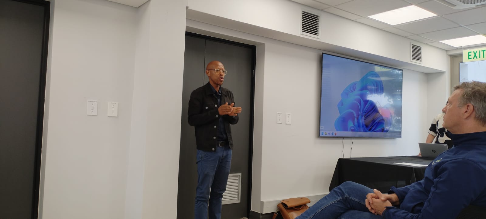 Person on a laptop in a bright room